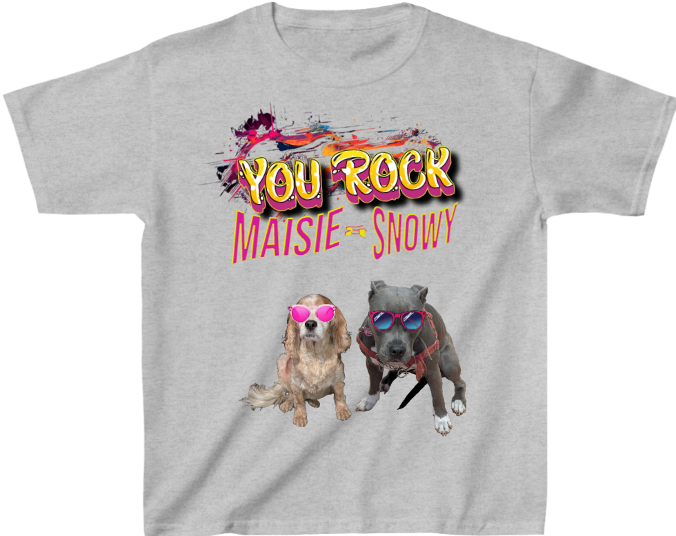 A light heather gray short-sleeve t-shirt with a colorful graphic print. The design features the text 'YOU ROCK MAISIE = SNOWY' in stylized yellow, pink, and black lettering above two dogs wearing pink sunglasses.