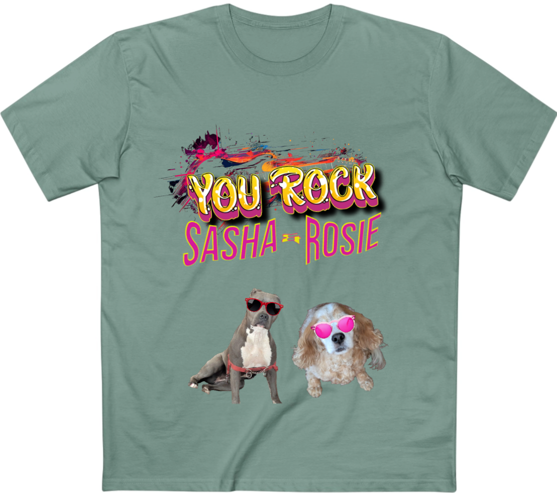 A sage green crewneck t-shirt featuring a colorful graphic print that reads 'YOU ROCK SASHA & ROSIE' above two small dogs wearing heart-shaped sunglasses.