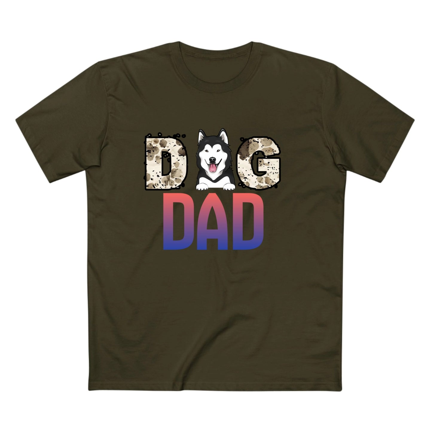 An olive green crewneck t-shirt featuring a graphic print that reads 'DOG DAD'. The letter 'O' is replaced with a cartoon husky dog head, and the letters 'D' and 'AD' below are filled with a red-to-blue gradient pattern, while 'G' has a leopard print texture.